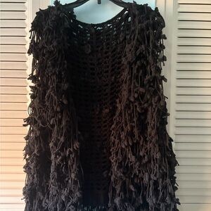 Beautiful black vest with long pretty strings hanging down. Very unique. Medium